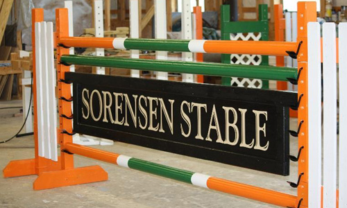 Sorensen stable sponsored horse jump with Dapple Equine horse jump cups